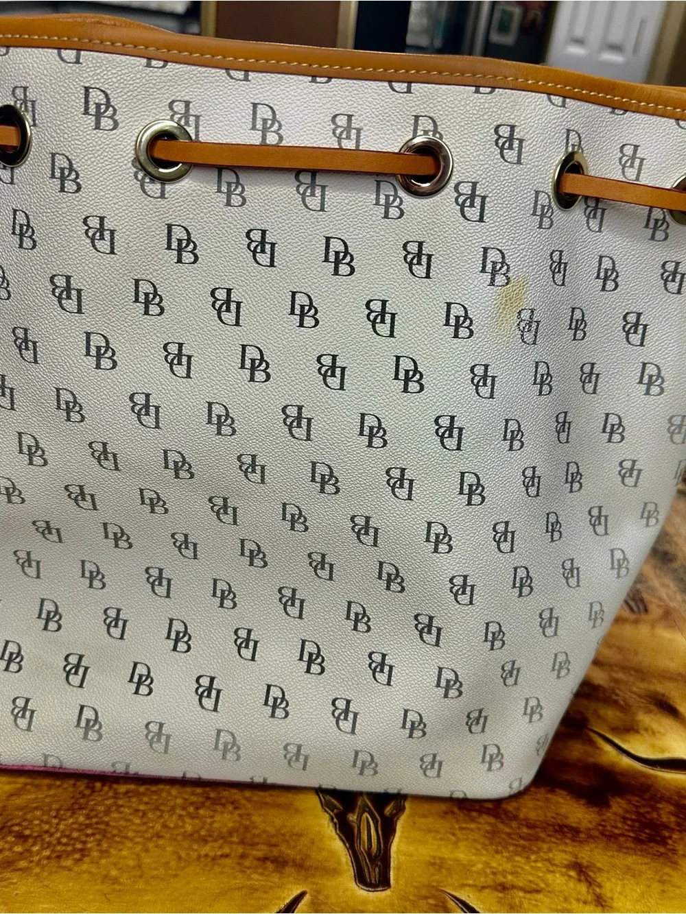 Dooney & Bourke White and Tan Tassel Drawstring Tote with DB Monogram